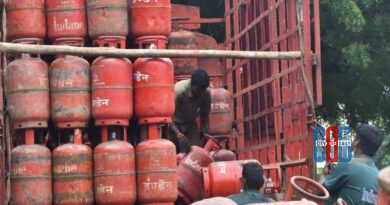 Domestic LPG gas cylinders stacked at a distribution centre highlighting government changes to LPG booking rules.