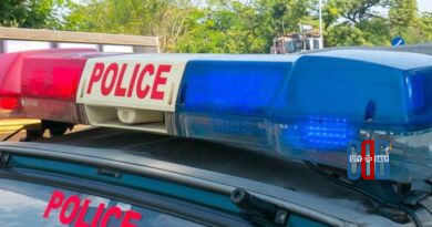 Police escorting a suspect arrested in a contract killing and woman murder case