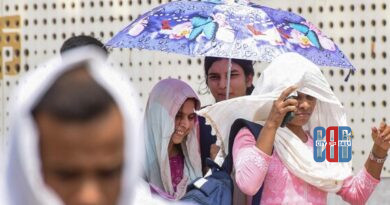 Scorching sunlight over a dry landscape in western India during a heat wave while dark rain clouds gather over northeastern hills.