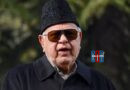 Security personnel protect Farooq Abdullah after firing incident at wedding ceremony