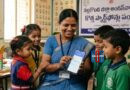 Anganwadi teacher using a smartphone to update data on Poshan Tracker application
