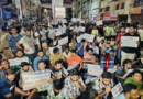 Unemployed youth holding books during protest march in Hyderabad demanding government job notifications