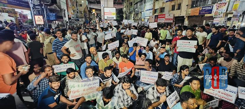 Unemployed youth holding books during protest march in Hyderabad demanding government job notifications