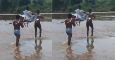 Tribals forced to wade through flooding stream carrying pregnant woman in Asifabad